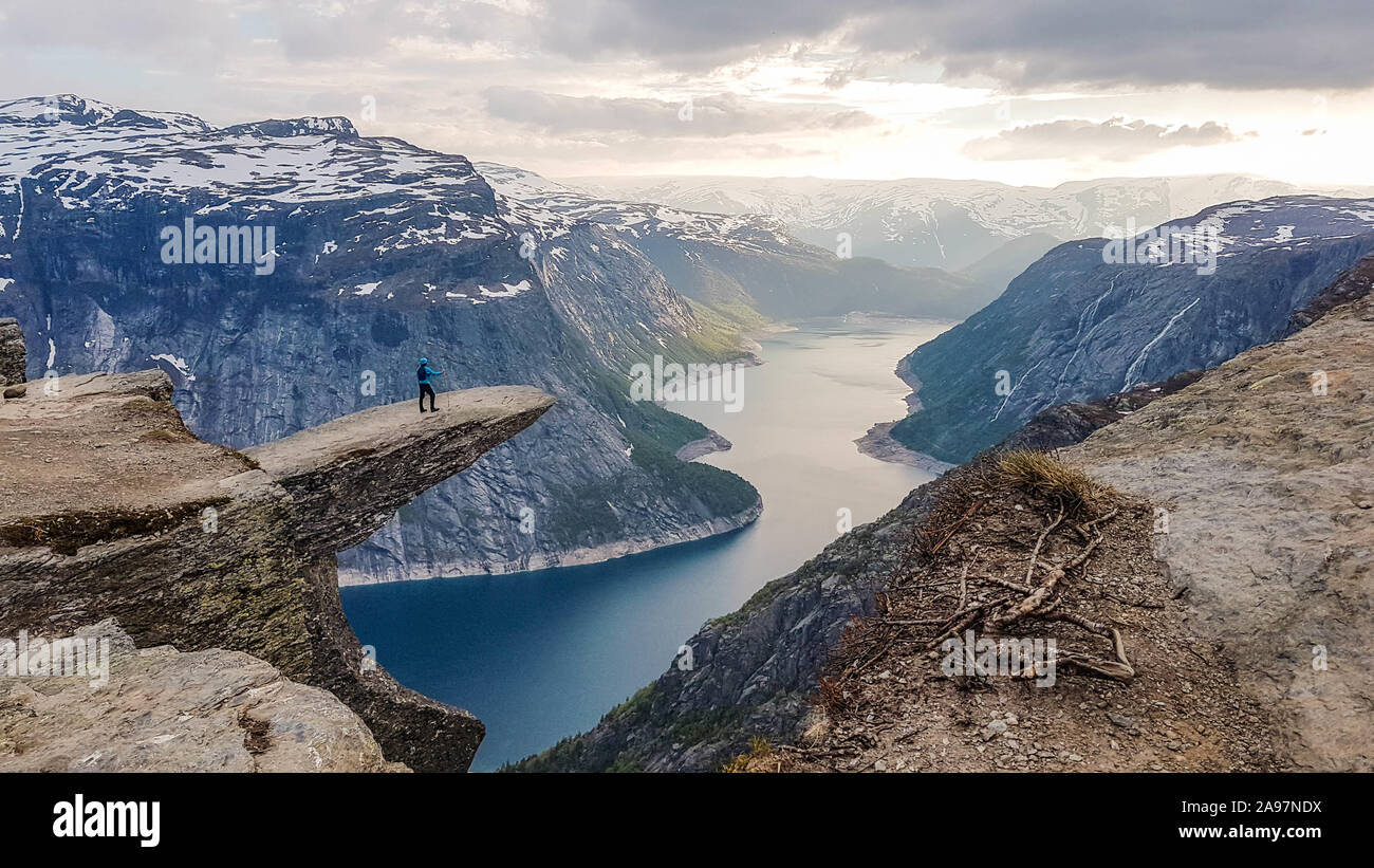 Beautiful hike in the middle of the wilderness in Norway.One of the most famous hikes in the world with a rewarding view from the tongue of the troll, Stock Photo