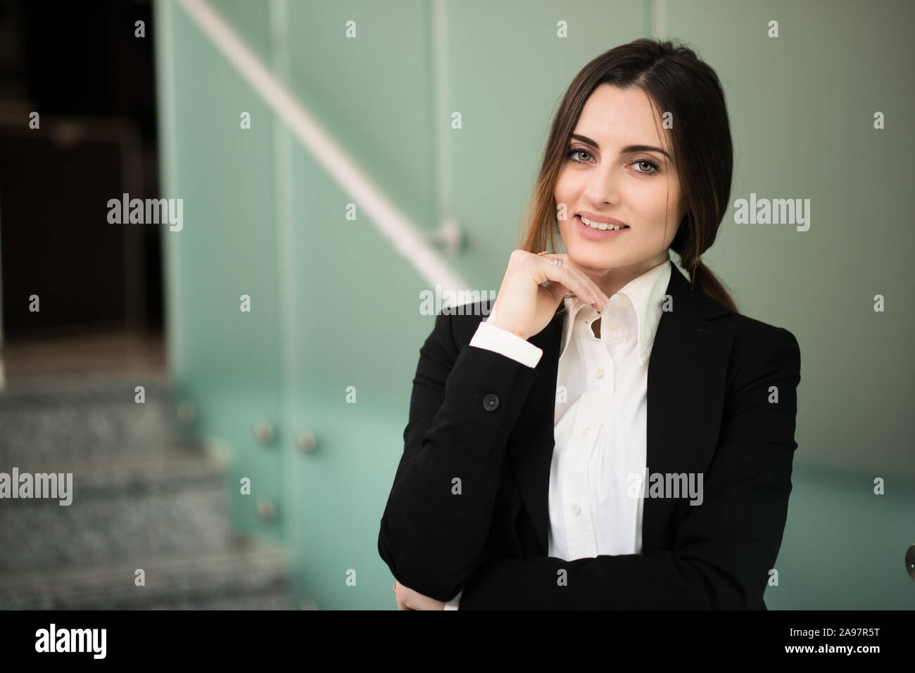 Portrait of a smiling business woman in her office Stock Photo - Alamy