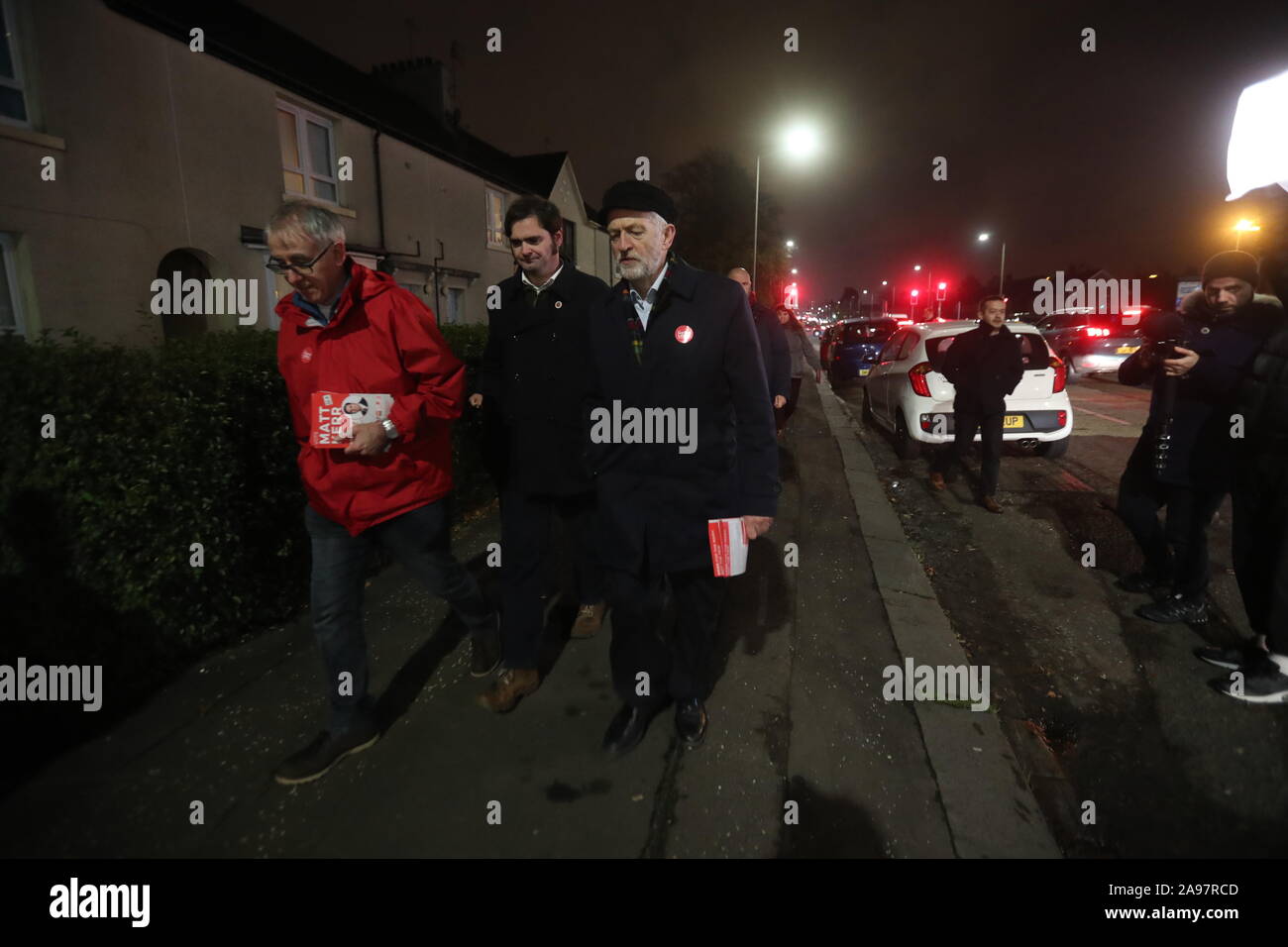 Labour Party leader Jeremy Corbyn (right) with local candidate Matt Kerr (centre) whilst canvassing in Govan, Glasgow, during General Election campaigning. PA Photo. Picture date: Wednesday November 13,2019. See PA story POLITICS Election. Photo credit should read: Andrew Milligan/PA Wire Stock Photo