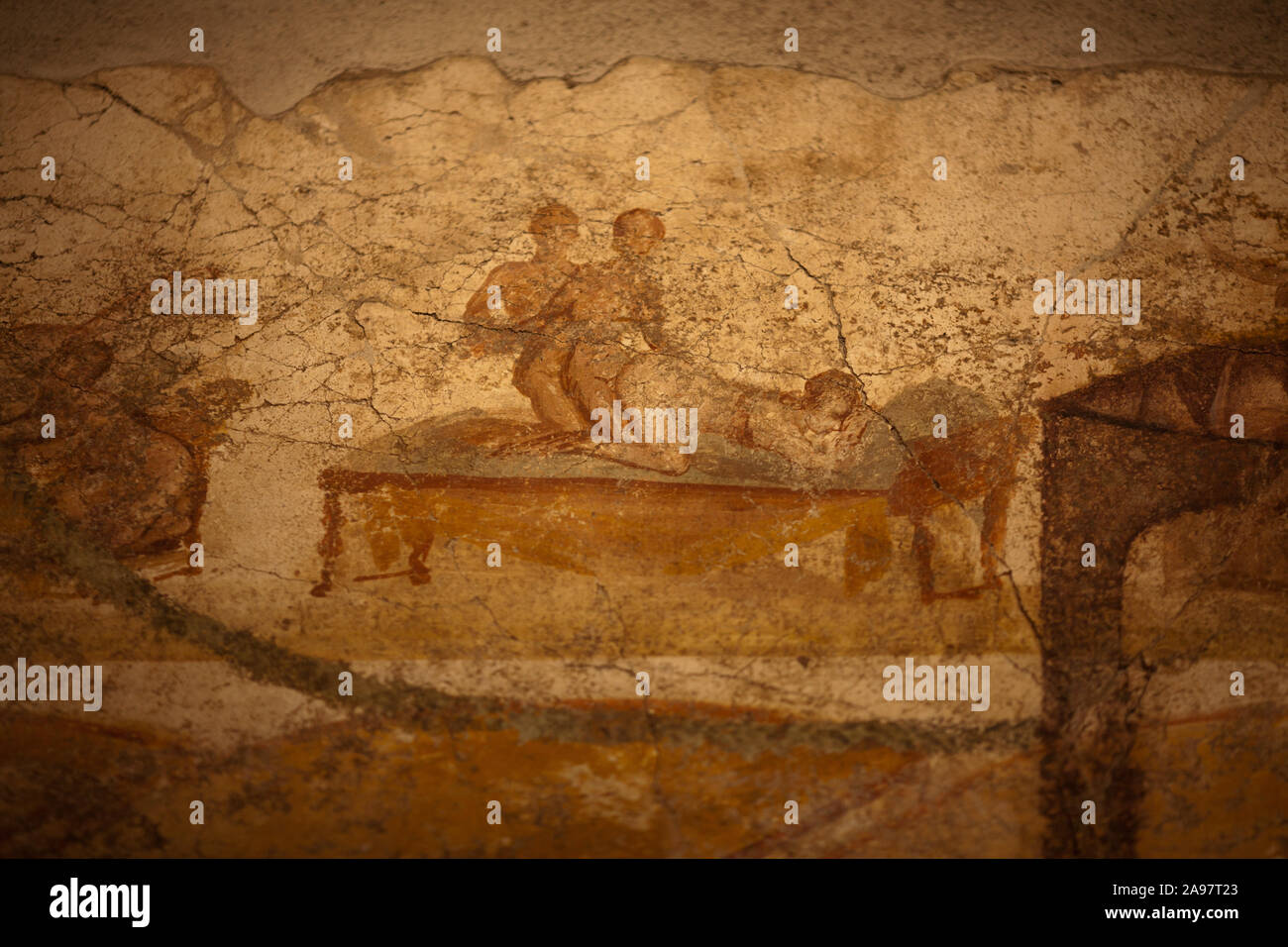 Erotic art depicting a threesome in the bathhouses of Pompeii Stock Photo