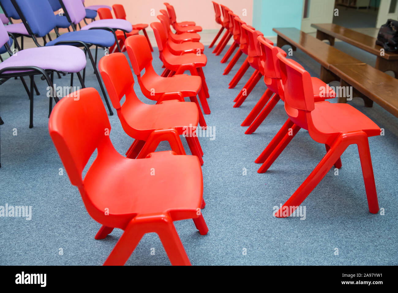 kindergarten class with the red kids chairs . Red chairs in Montessori