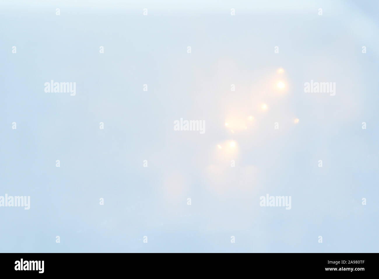 delicate abstract pastel blue background with gold sequins copy space Stock Photo