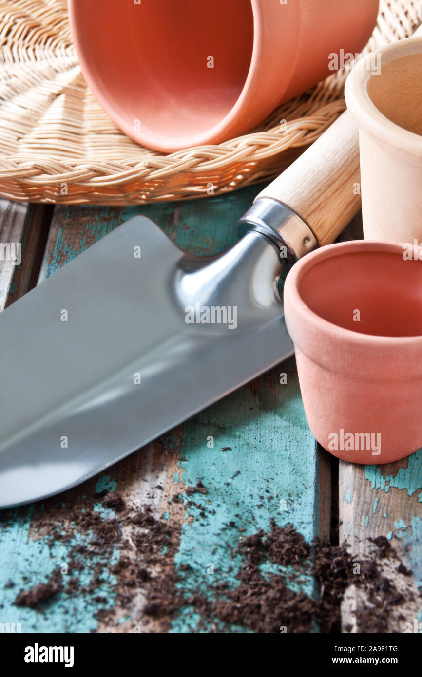 Garden work with shovel and flower pots Stock Photo - Alamy