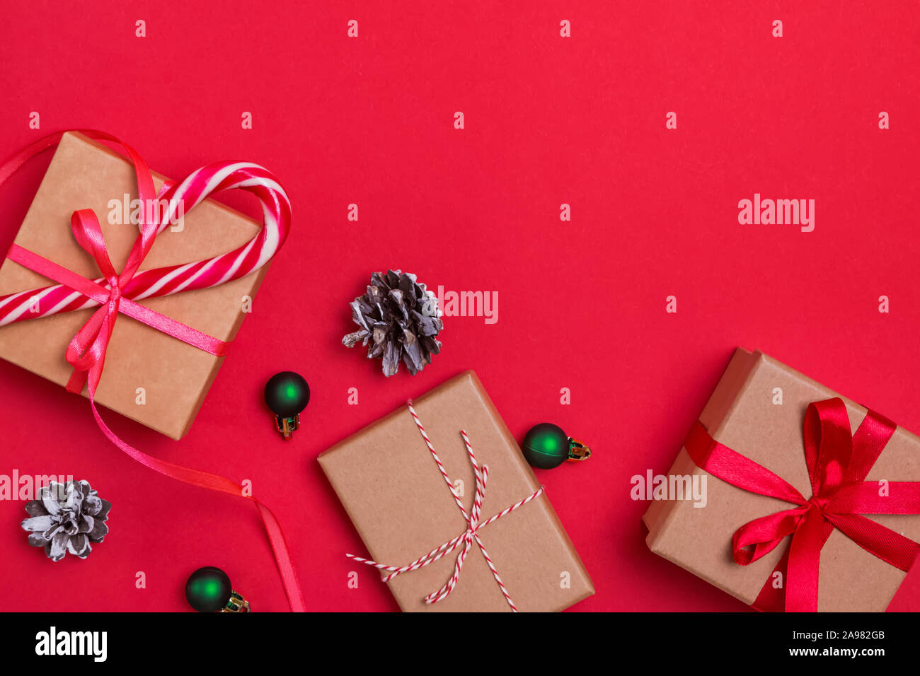 Christmas flat lay with gift boxes and pine cones Stock Photo