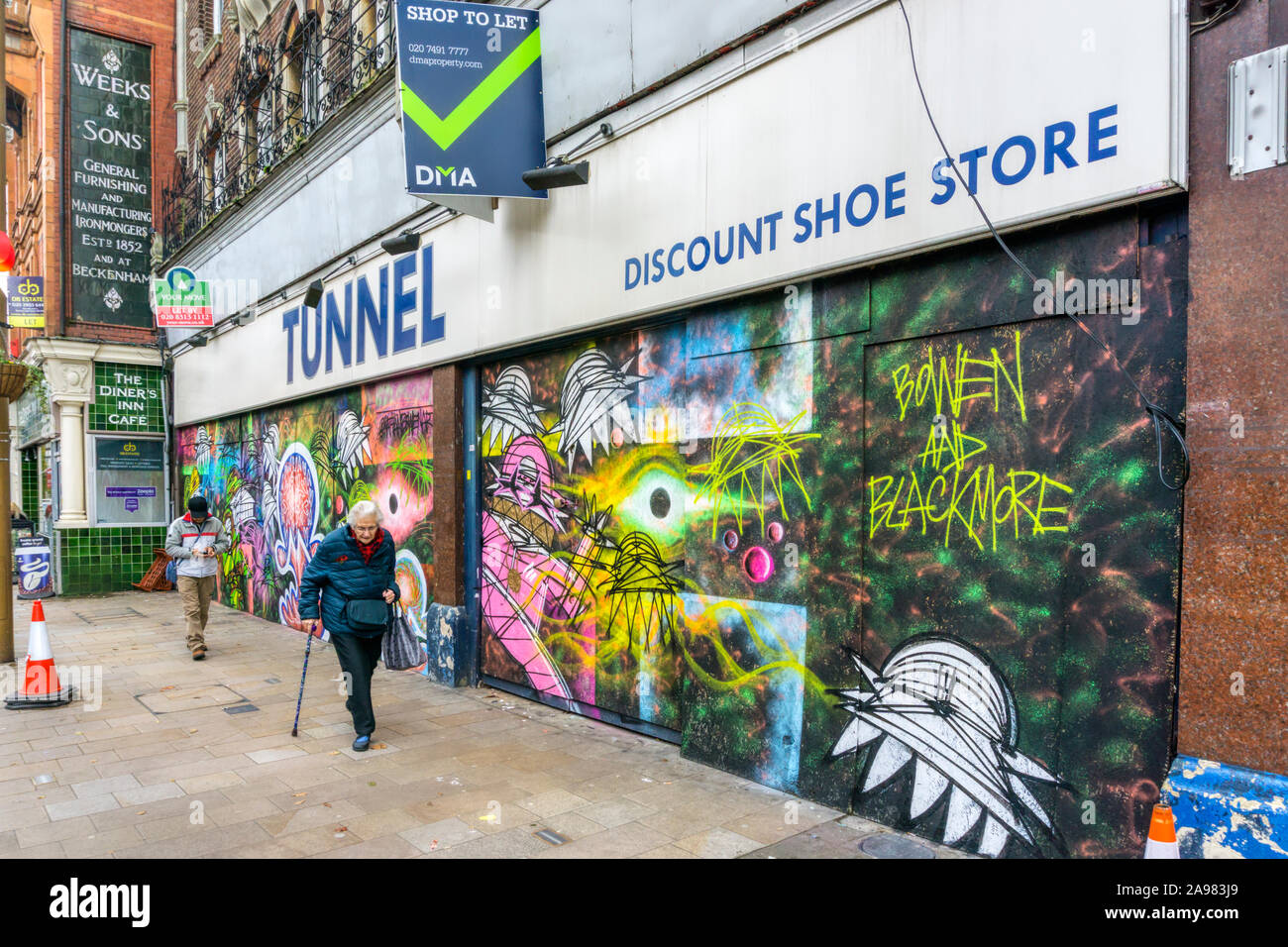 Graffiti collaboration by Nathan Bowen and Harry Blackmore on an empty & to  let Tunnel Discount Shoe Store in Bromley High Street Stock Photo - Alamy