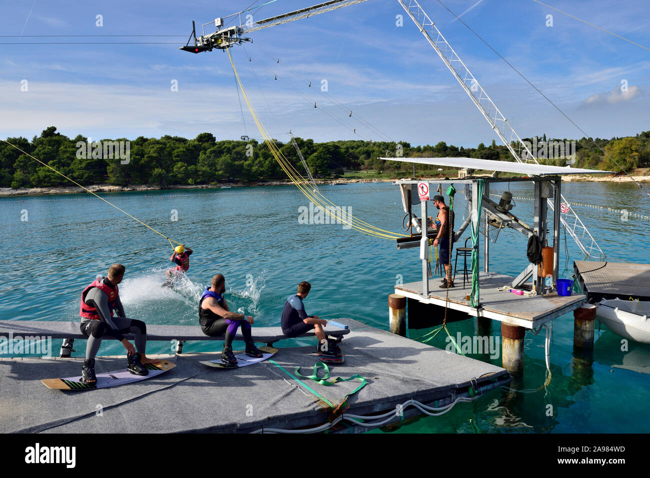 Launch station for cable wakeboarding on Uvala valovine bay outskirts of Pula, Croatia. Wakeboarding being pulled by overhead cable instead of boat Stock Photo