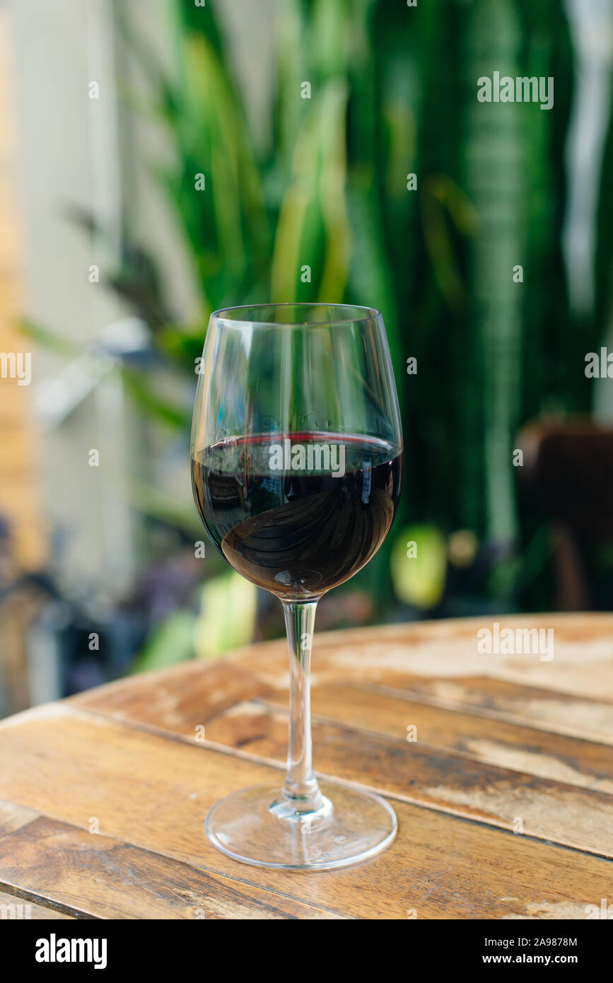 Dry, semidry, sweet red wines in special wine glasses on old wooden
