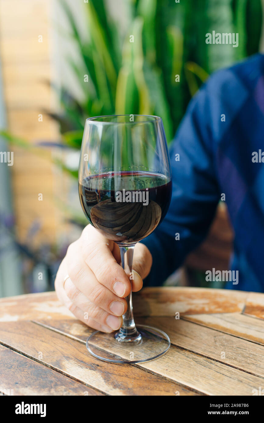 Dry, semidry, sweet red wines in special wine glasses on old wooden