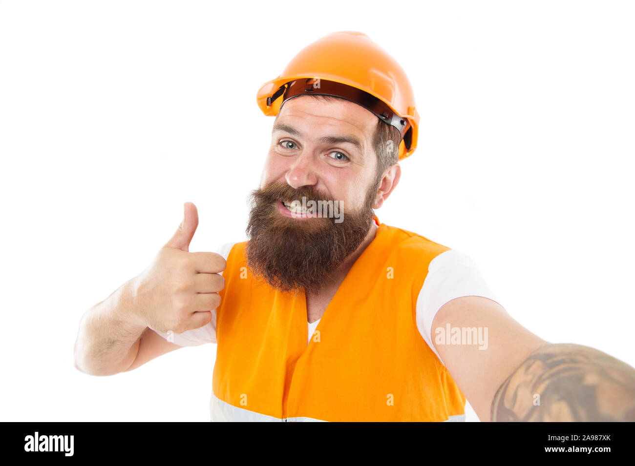 Master committed to superior quality and results. Master builder give  thumbs up hand. Bearded man master happy smiling isolated on white. Worker  in protective helmet and safety vest. Master of craft Stock