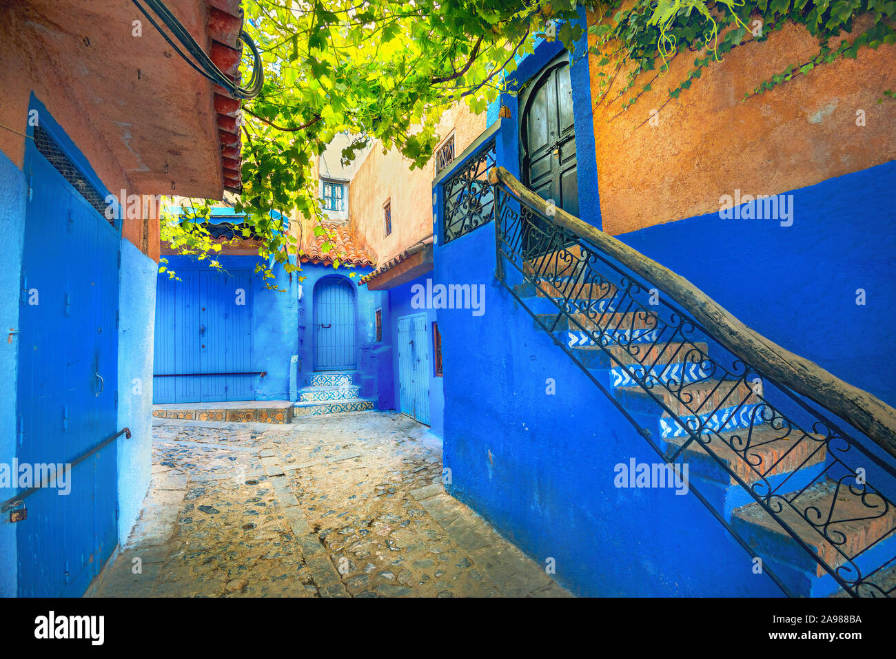 Street with blue coloured houses in old medina of Chefchaouen. Morocco,  North Africa Stock Photo