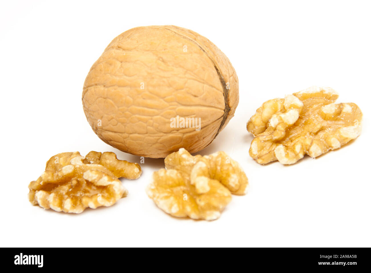 Walnuts against white background close up Stock Photo