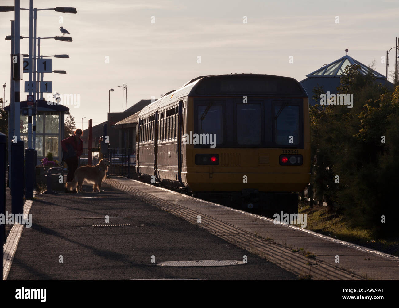 Arriva Northern rail class 142 pacer train at Morecambe with waiting passengers Stock Photo