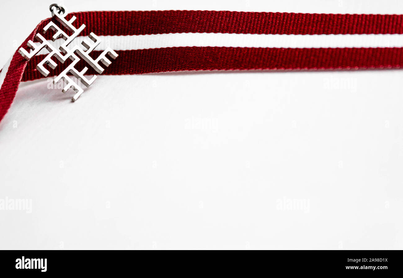 Ribbon in Latvian flag colors and Latvian traditional thunder cross ...