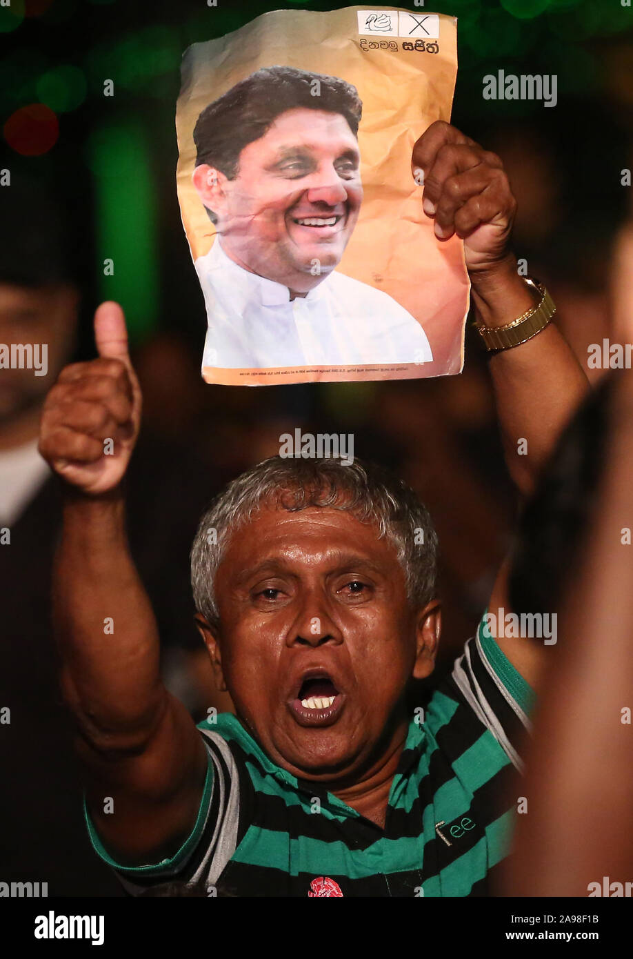 Colombo, western province, Sri Lanka. 13th Nov, 2019. Supporter of the ruling United National Party (UNP) and New Democratic Front (NDF) presidential candidate Sajith Premadasa attend a final campaign rally under rain in Colombo on November 13, 2019, ahead of the November 16 presidential election. Police stepped up security across Sri Lanka on November 13 over fears of violence on the final day of campaigning for the fiercely contested presidential election, officials said. Credit: Pradeep Dambarage/ZUMA Wire/Alamy Live News Stock Photo