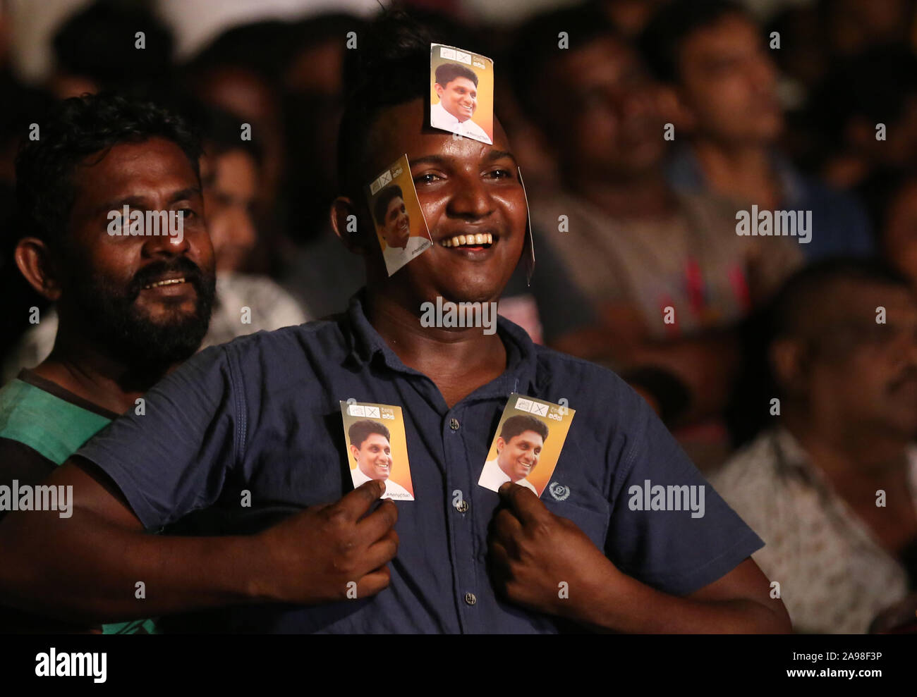 Colombo, western province, Sri Lanka. 13th Nov, 2019. Supporters of the ruling United National Party (UNP) and New Democratic Front (NDF) presidential candidate Sajith Premadasa attend a final campaign rally under rain in Colombo on November 13, 2019, ahead of the November 16 presidential election. Police stepped up security across Sri Lanka on November 13 over fears of violence on the final day of campaigning for the fiercely contested presidential election, officials said. Credit: Pradeep Dambarage/ZUMA Wire/Alamy Live News Stock Photo