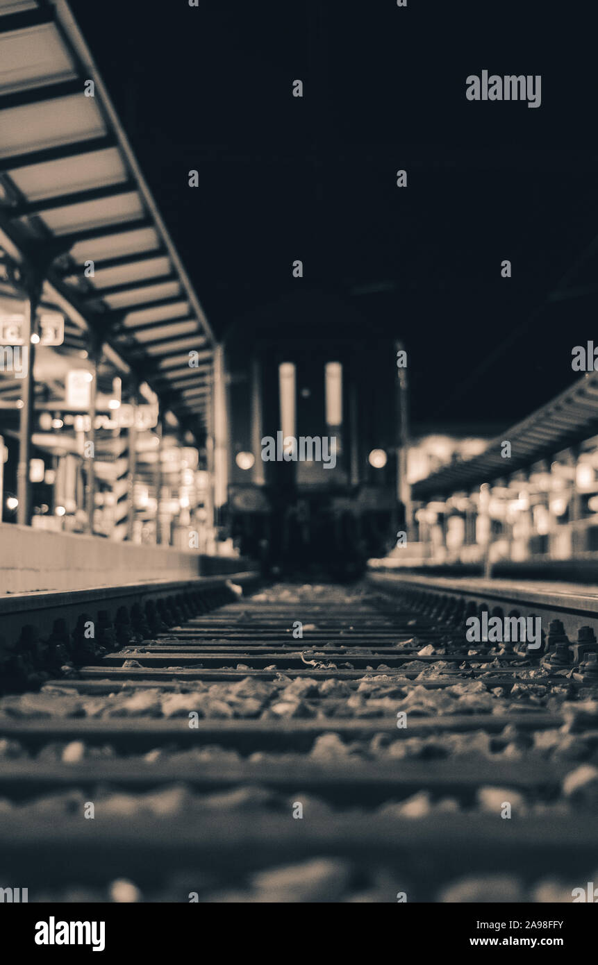 Ominous train tracks by night Stock Photo