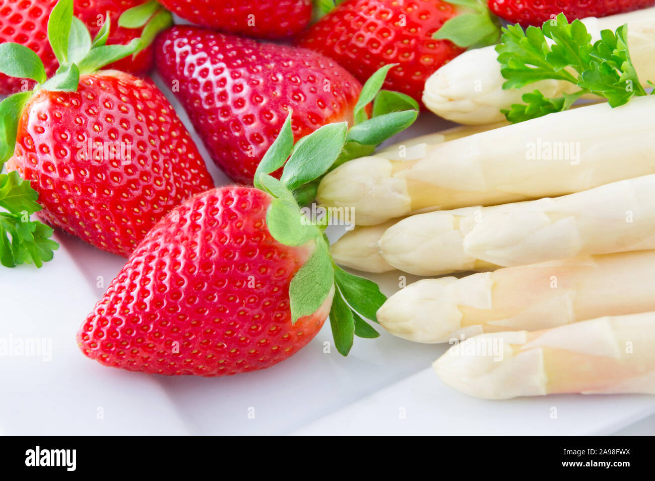 Asparagus and strawberries Stock Photo