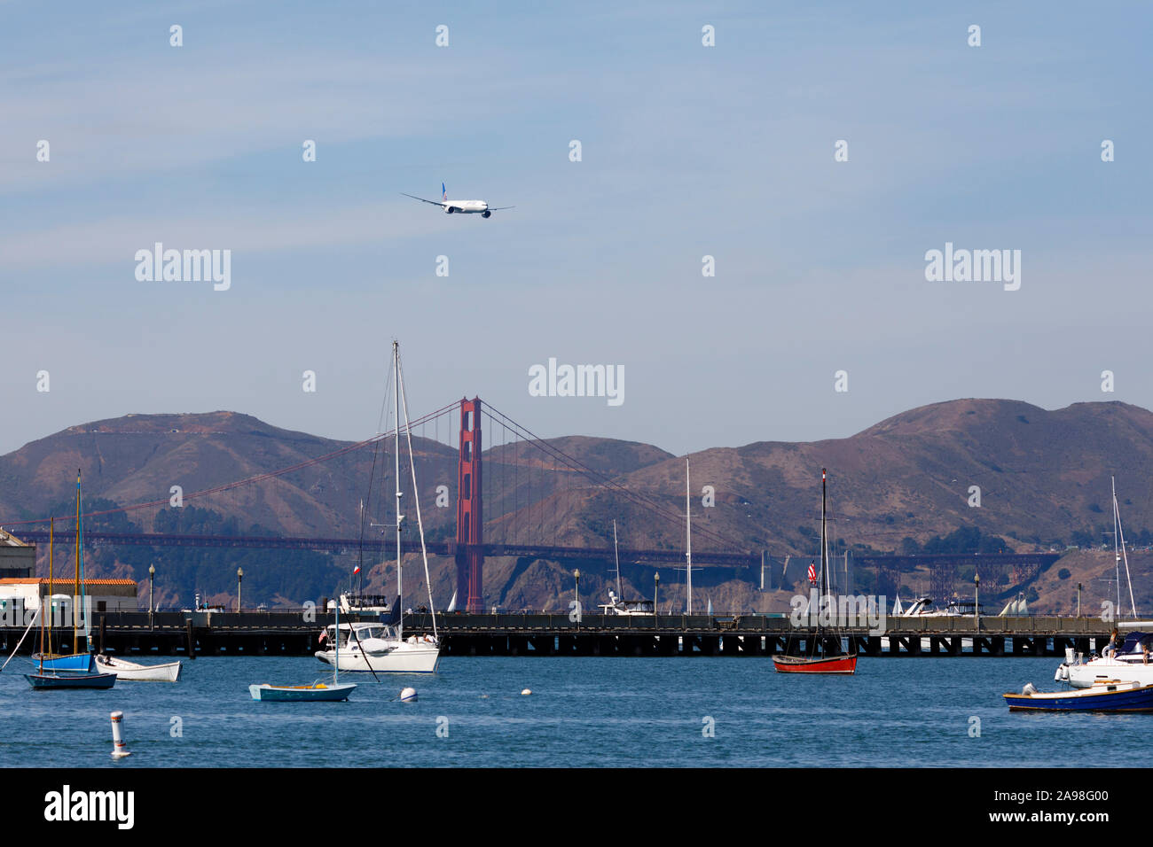 Boeing 777-322(ER) displaying over San Francisco Bay and Golden Gate Bridge, during Fleet Week 2019, California,USA Stock Photo