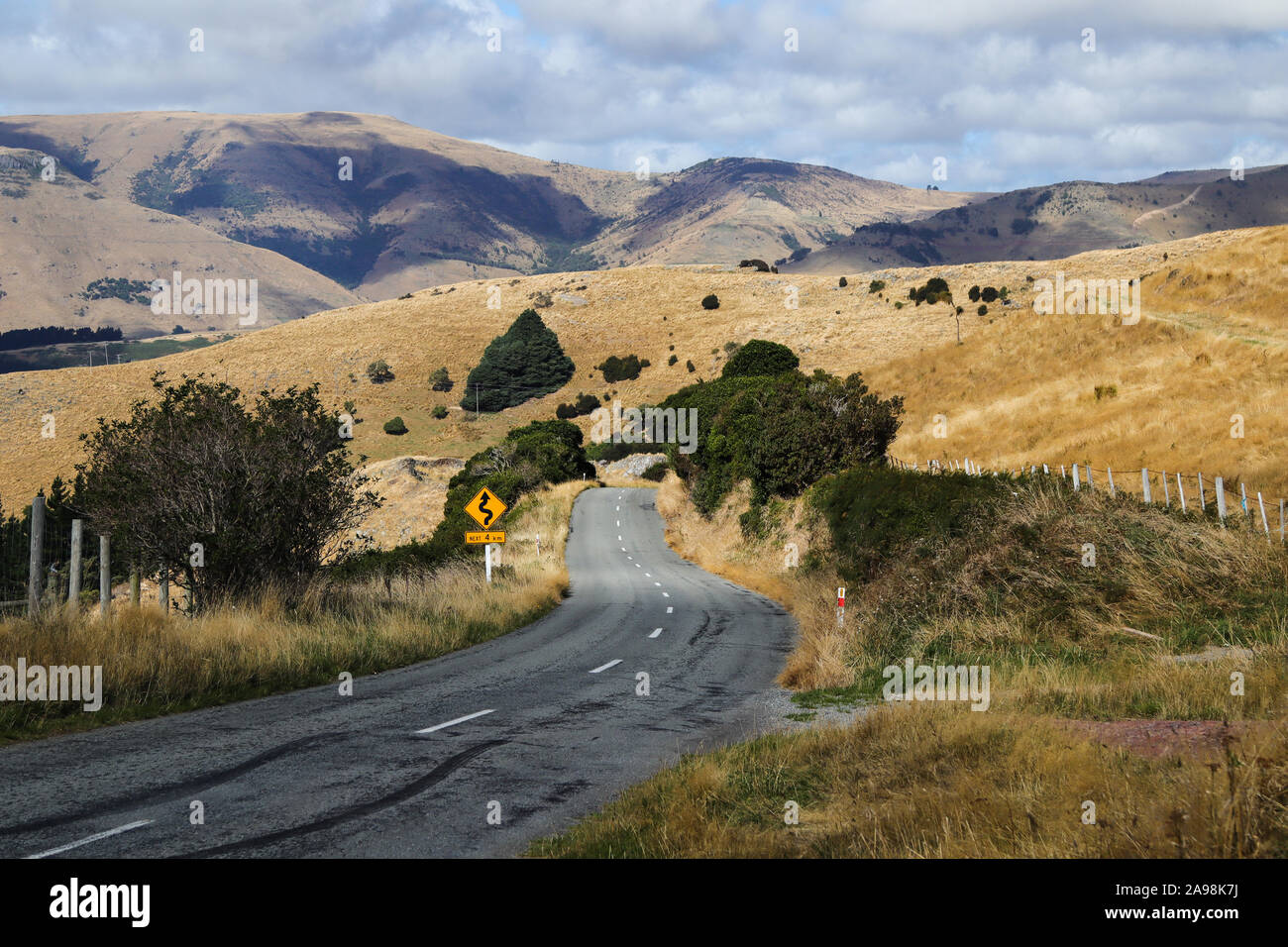 Hilly and curvy road on top of a mountain Stock Photo