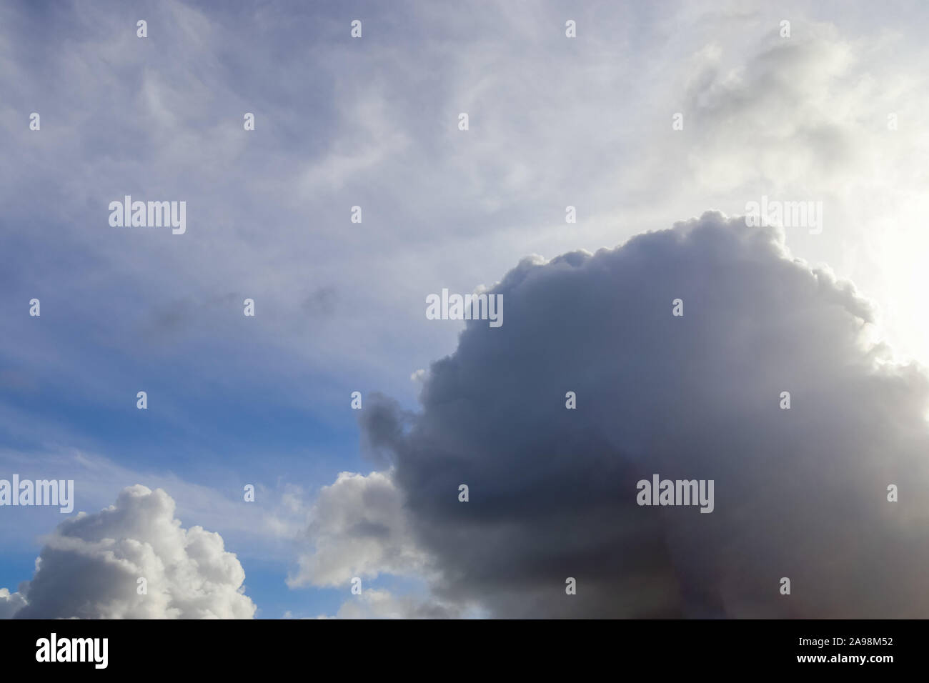 Beautiful fluffy white clouds on a deep blue sky Stock Photo - Alamy