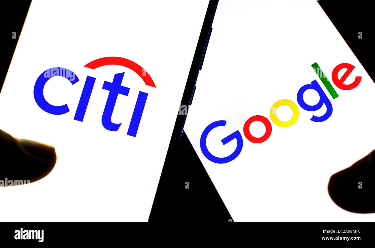 Google and Citibank logo on smartphones hold in hands in dark. Editorial Illustrative photo for news that Google partnered with Citigroup Stock Photo
