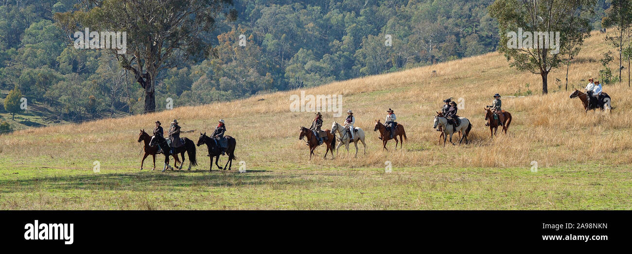 CORRYONG, VICTORIA, AUSTRALIA - APRIL 5TH 2019: The Man From Snowy River Bush Festival re-enactment, riders on horseback come down from out of the bus Stock Photo