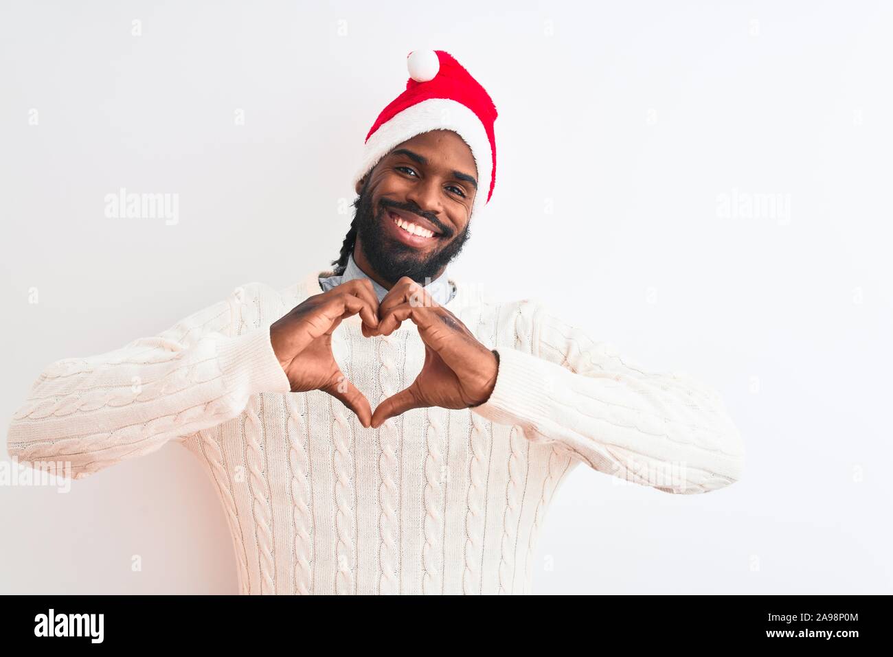 Young african american man wearing Christmas Santa hat over isolated ...