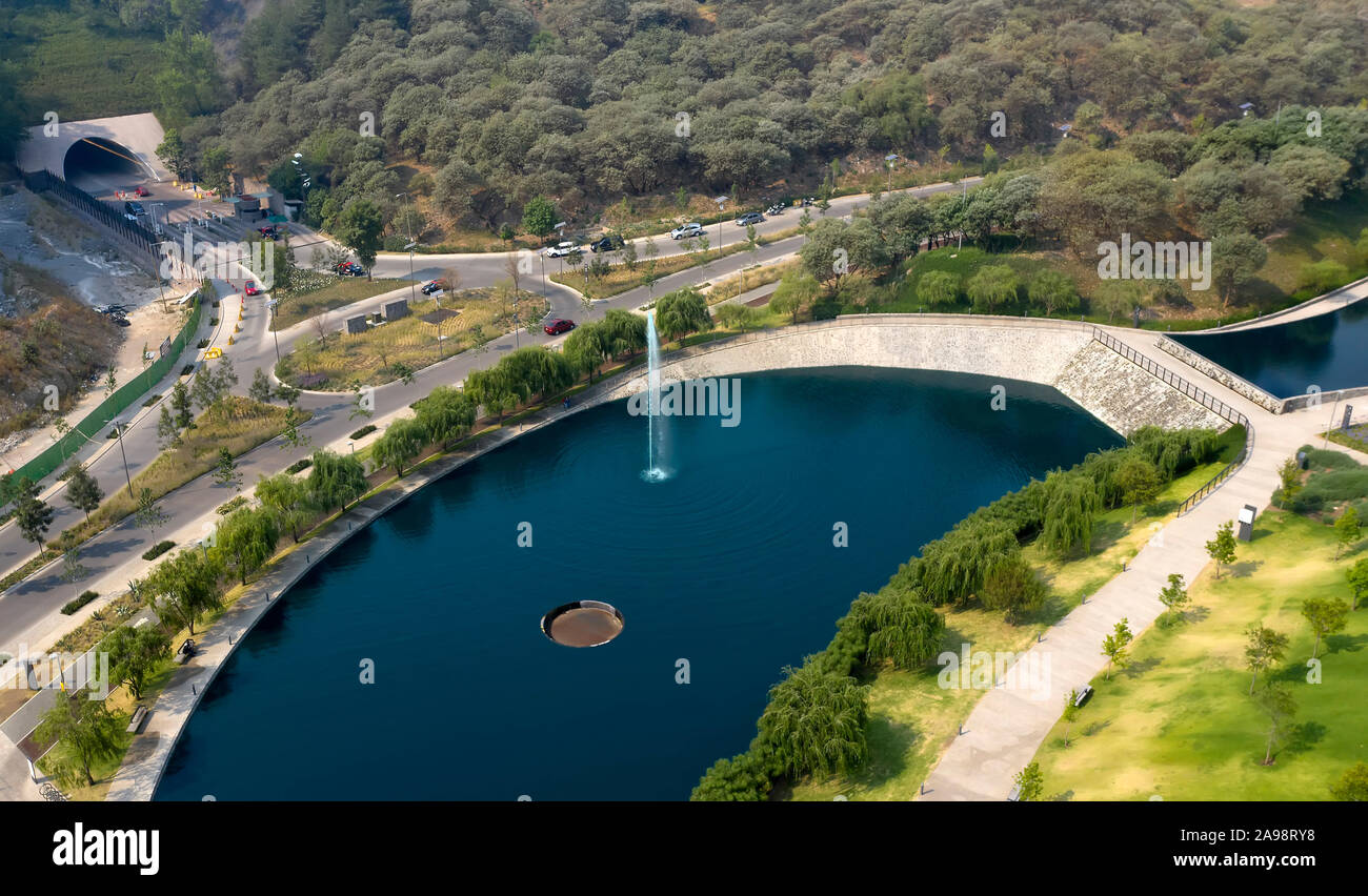 Aerial (drone) shot of lake and fountain in La Mexicana Park, Santa Fe, Mexico City, Mexico Stock Photo