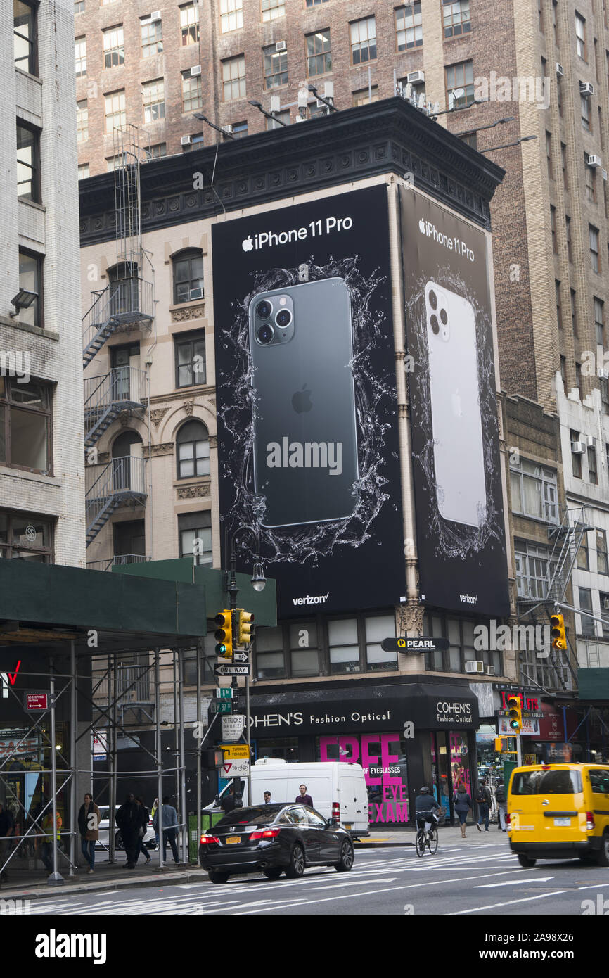 Large ad for the Apple iPhone 11 on a building on 8th Avenue at 37th Street in Manhattan, New York City. Stock Photo