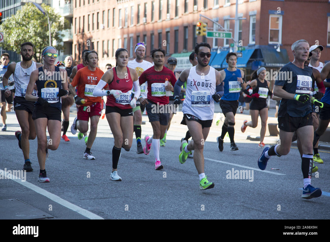 Runners from New York and around the world at the 2019 New York City Marathon hoof it down 4th