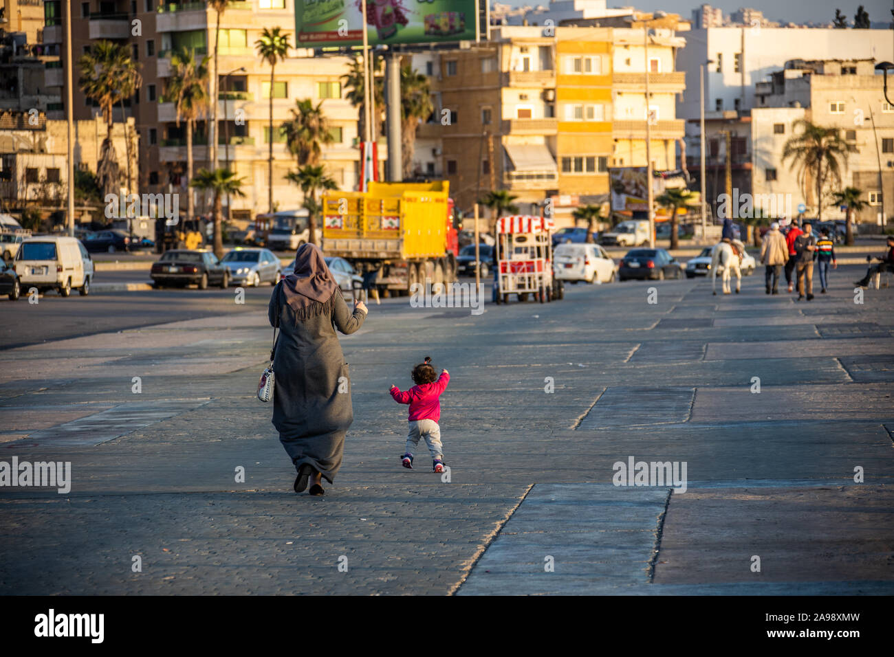 Local woman and her baby girl on the Waterfront, Sidon, Lebanon Stock Photo