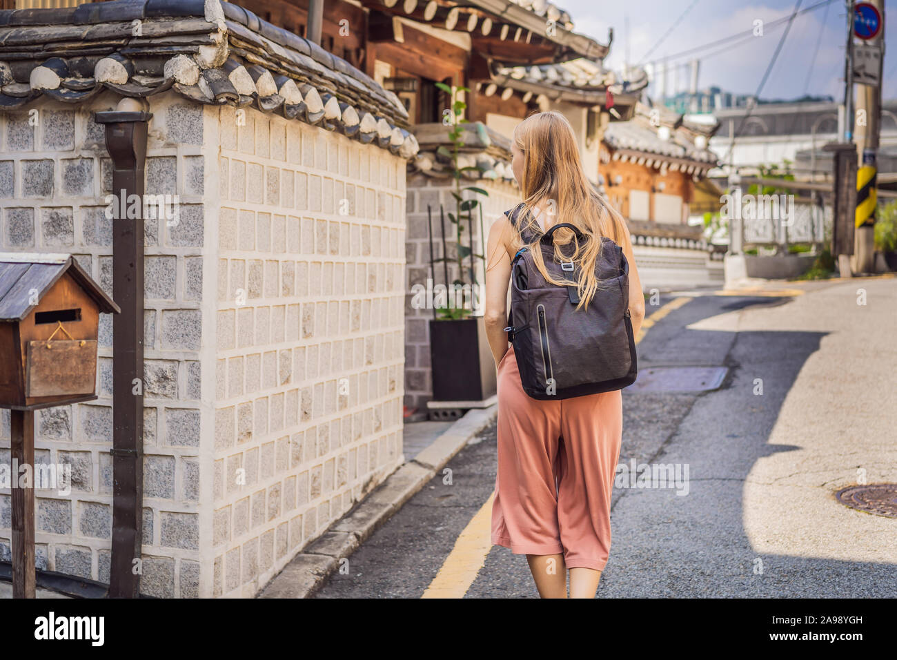 Young woman tourist in Bukchon Hanok Village is one of the famous place ...