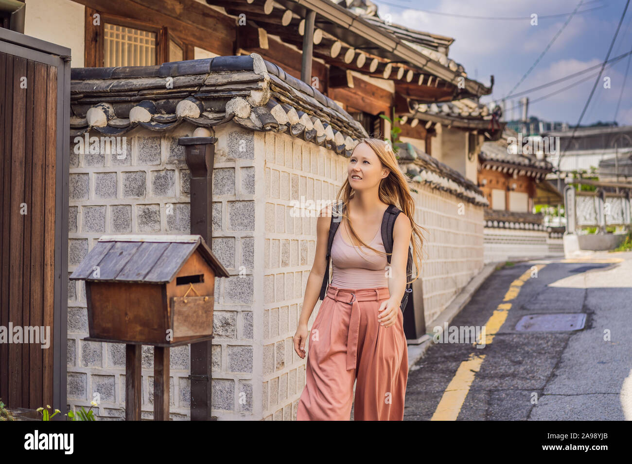 Young woman tourist in Bukchon Hanok Village is one of the famous place ...