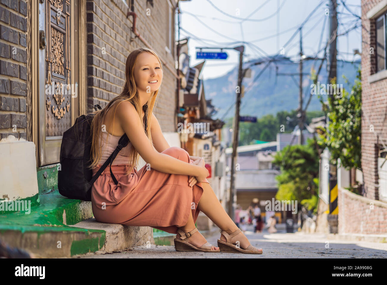 Young woman tourist in Bukchon Hanok Village is one of the famous place ...