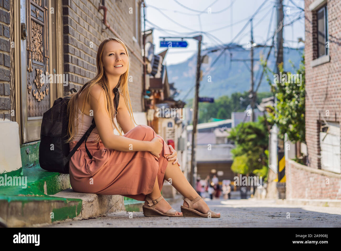 Young woman tourist in Bukchon Hanok Village is one of the famous place ...