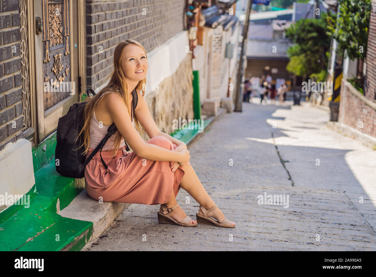 Young woman tourist in Bukchon Hanok Village is one of the famous place ...