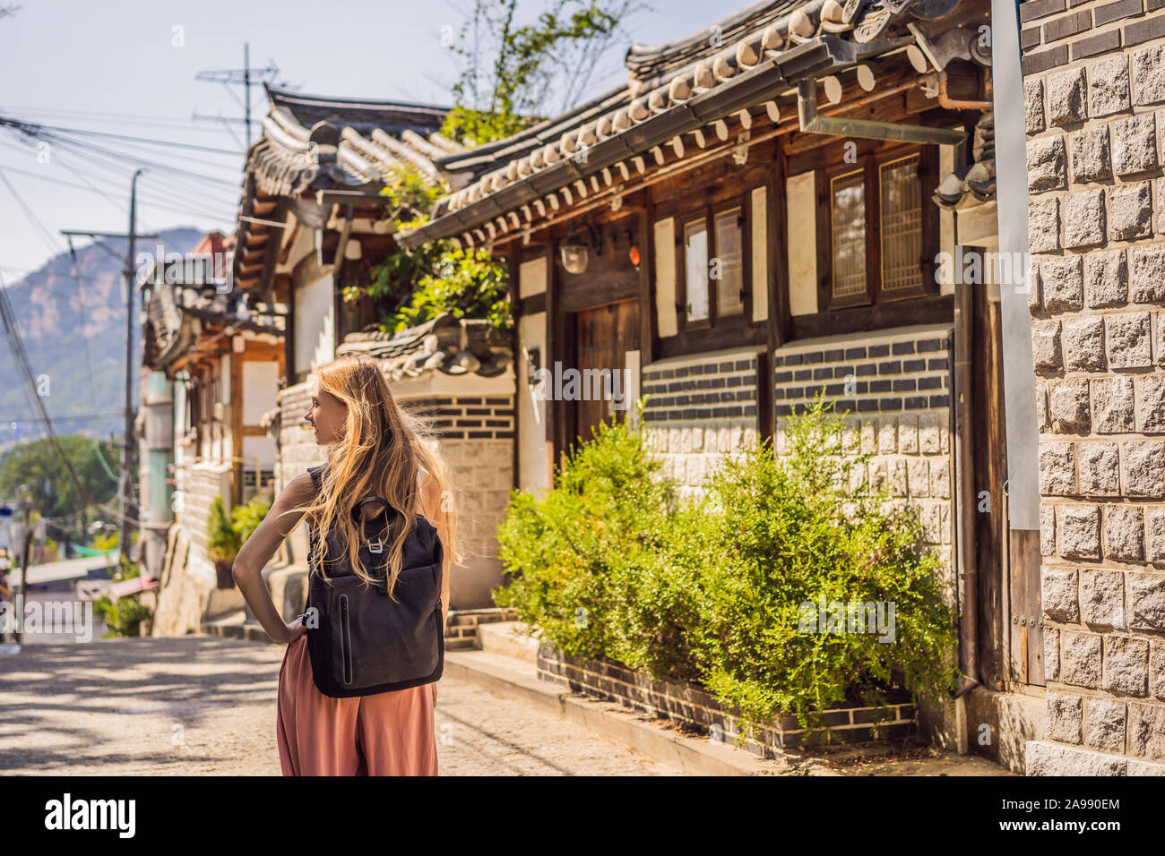 Young woman tourist in Bukchon Hanok Village is one of the famous place ...