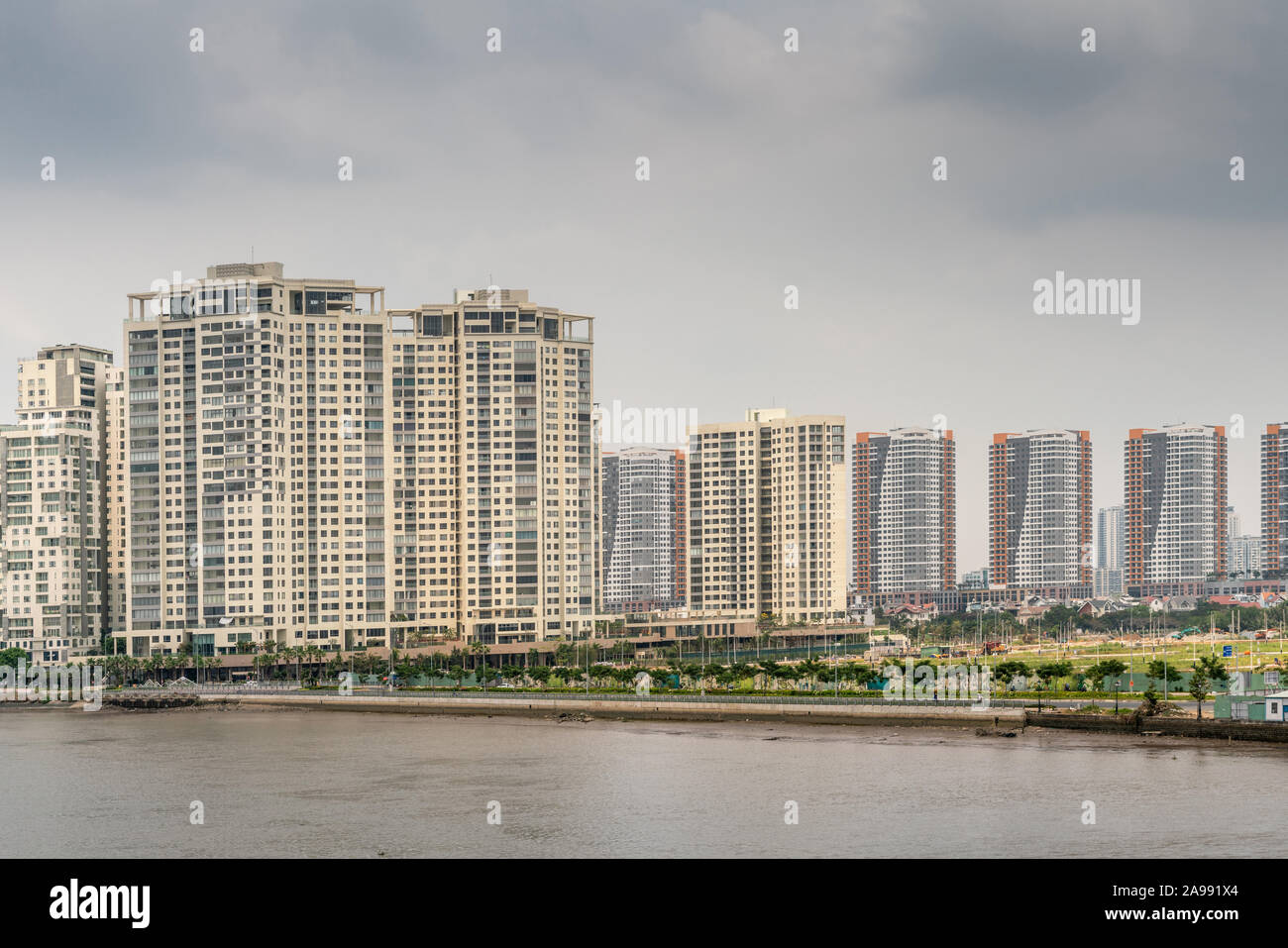 Ho Chi Minh City, Vietnam - March 12, 2019: Song Sai Gon river. High rise apartment buildings form skyline in Binh Trung Tay neighborhood accross the Stock Photo