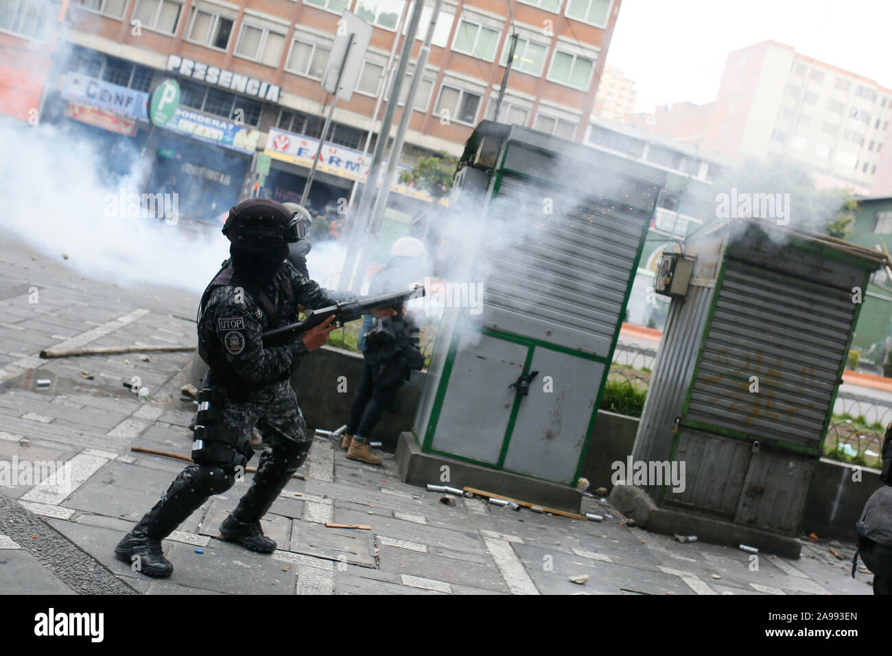 La Paz, Bolivia. 13th Nov, 2019. A UTOP policeman shoots tear gas at