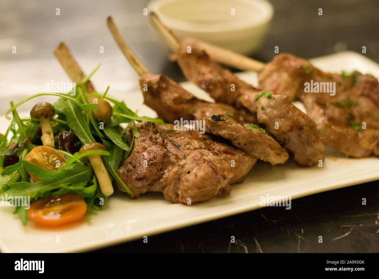 grilled rack of lamb lamb chops with mushroom and salad on the side