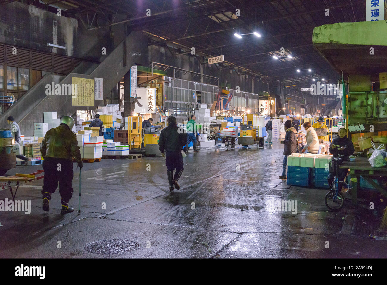 TOKYO, JAPAN - MARCH 17, 2014: Morning workers at Tsukiji Fish Market in Tokyo. Stock Photo
