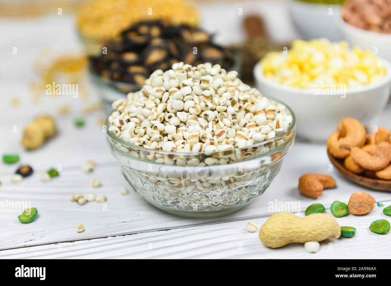 Adlay millet or pearl millet white Job's tears on bowl / Coix Lachrymal