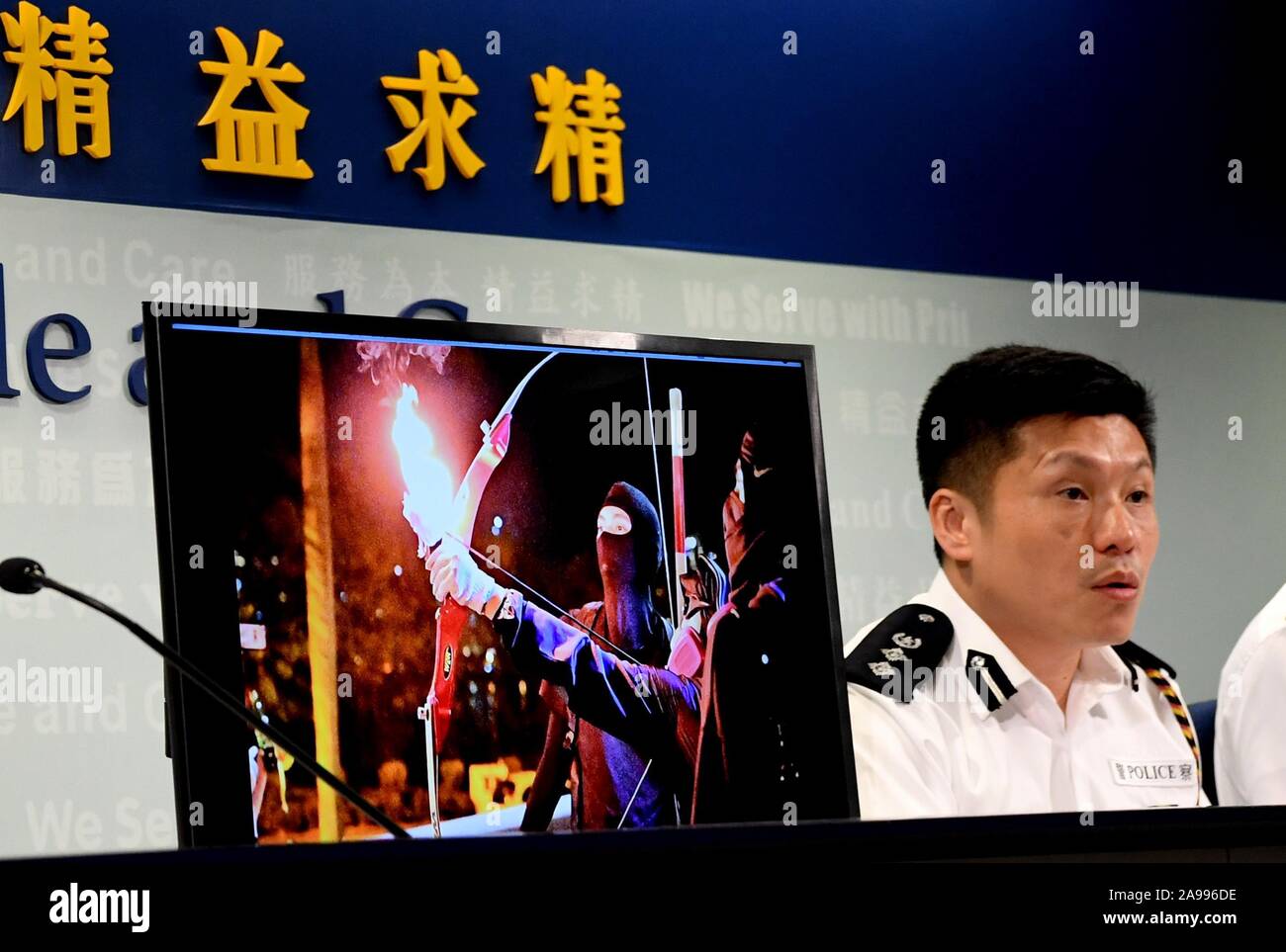 Hong Kong, China. 13th Nov, 2019. Chief Superintendent of Police Public Relations Branch Tse Chun-chung shows an evidence image of violent acts by rioters at a press conference in Hong Kong, south China, Nov. 13, 2019. Universities in Hong Kong are by no means a lawless frontier, and the police are legally responsible for taking actions against any law-breaking activities, Tse Chun-chung said. Credit: Zhu Xiang/Xinhua/Alamy Live News Stock Photo