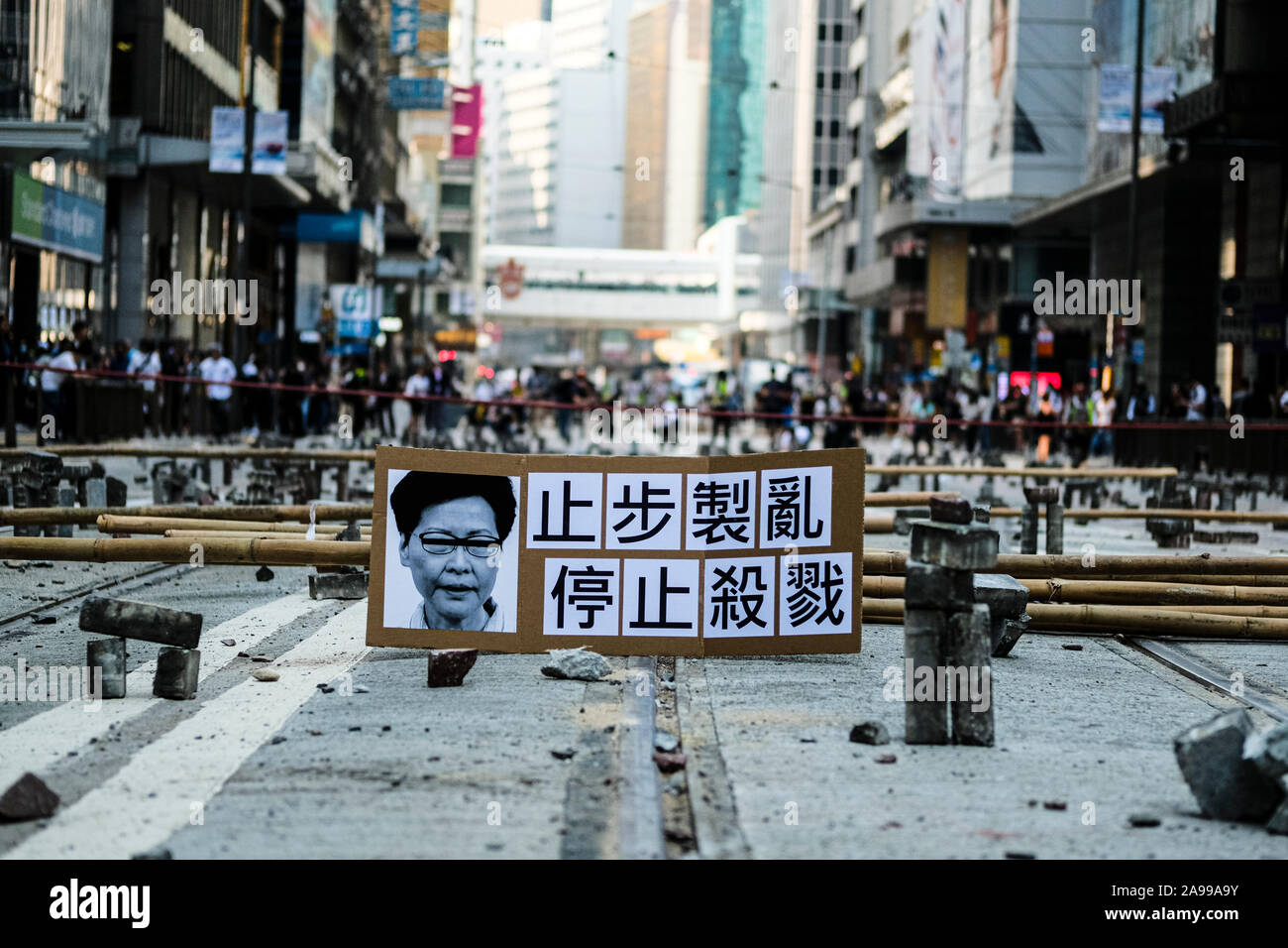 Hong Kong, China. 13th Nov, 2019. Demonstrators set up bricks to block traffic during a protest in the Central district Hong Kong. A 'Blossom Everywhere' action was organized by the protestors to paralyze traffic and vandalize things across Hong Kong for its third consecutive days and have sparked some of the worst violence in five months of unrest. Credit: SOPA Images Limited/Alamy Live News Stock Photo