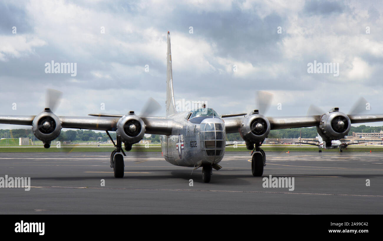 A World War II era PB4Y-2 Privateer flies into the 2015 Heavy Bombers Weekend in Madison, Wisconsin. Stock Photo