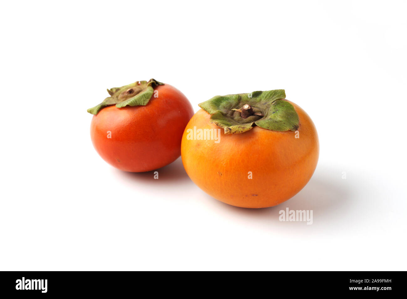 Persimin Ripe ripe persimmon isolated on white background Stock Photo - Alamy