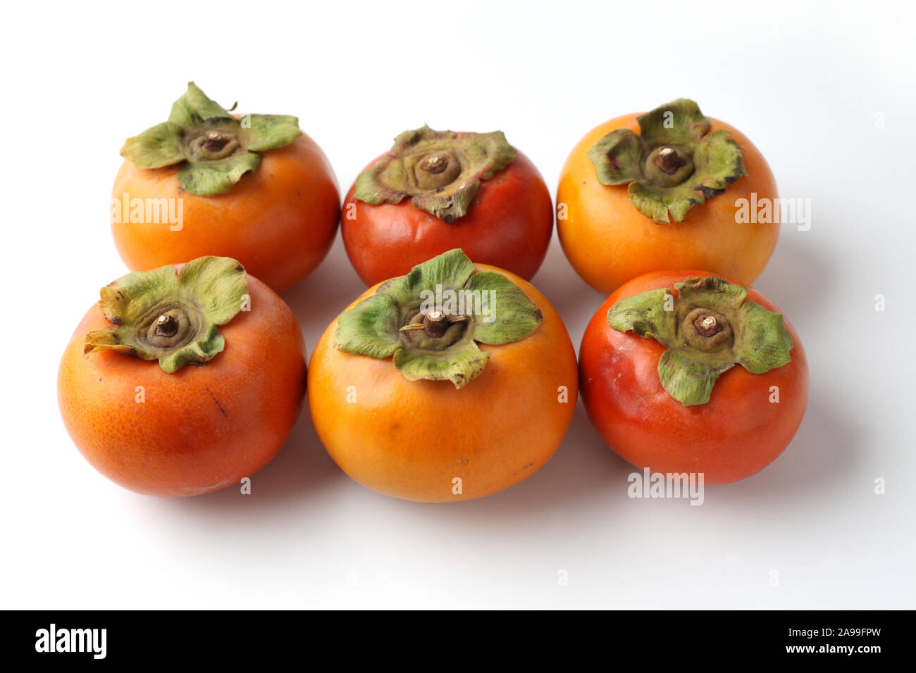 ripe persimmon isolated on white background Stock Photo - Alamy
