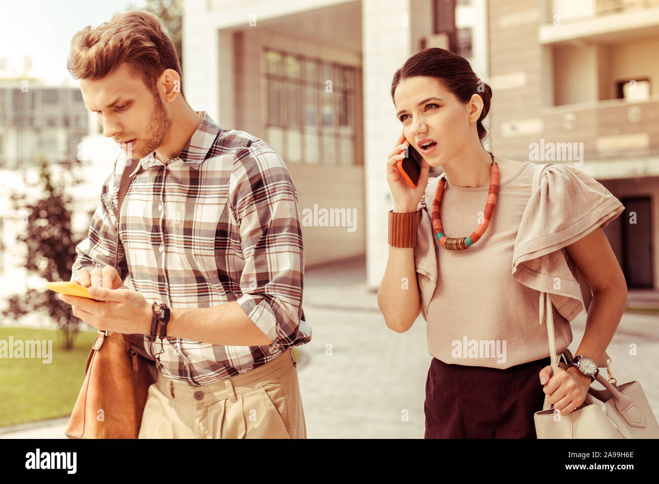 Emotional young female person talking per telephone Stock Photo