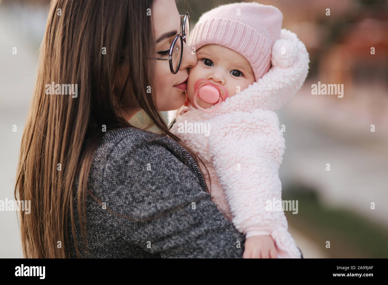 Portrait of mother and her little baby girl. Beautiful mom and ...