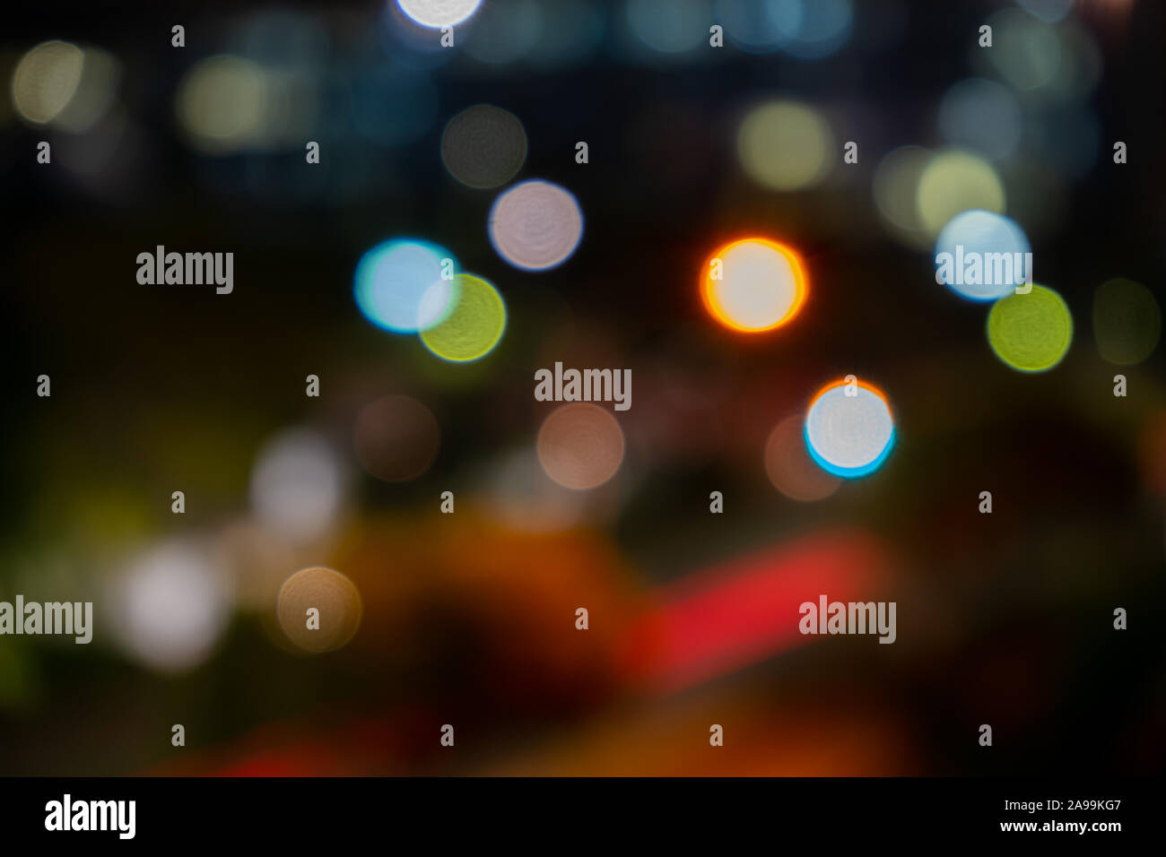 Defocused colourful city lights at night Stock Photo
